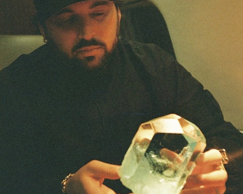 Ryan holding a large natural quartz crystal