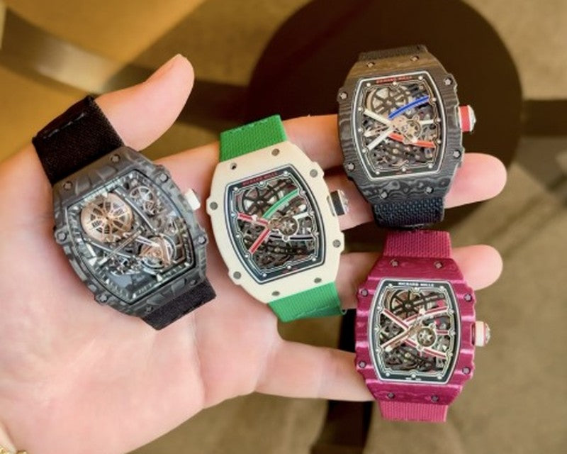 Four Richard Mille watches held in one hand