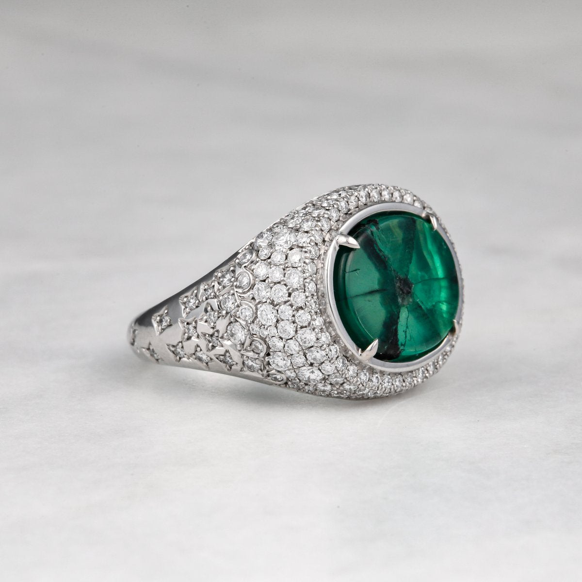 Custom pavé diamond ring set with a trapiche emerald in white gold